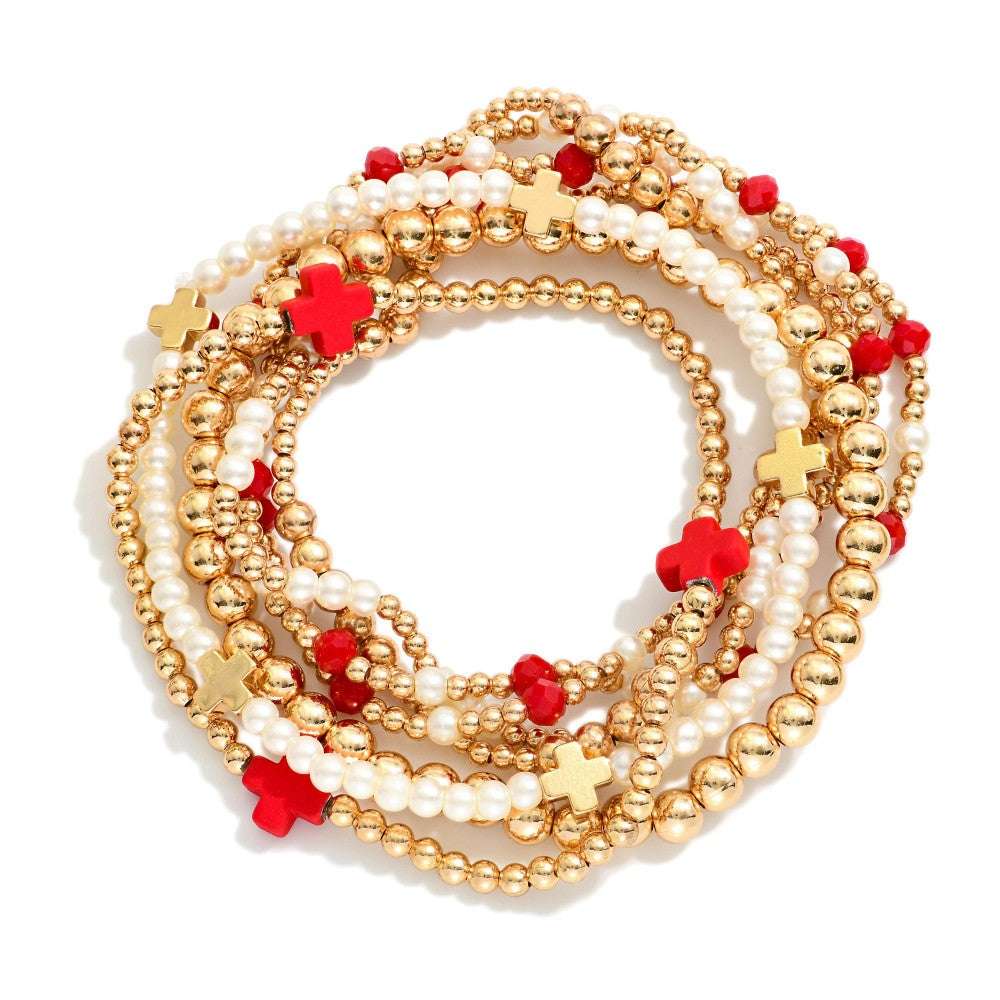 SET OF SEVEN GOLD TONE BEADED BRACELETS - RED AND WHITE