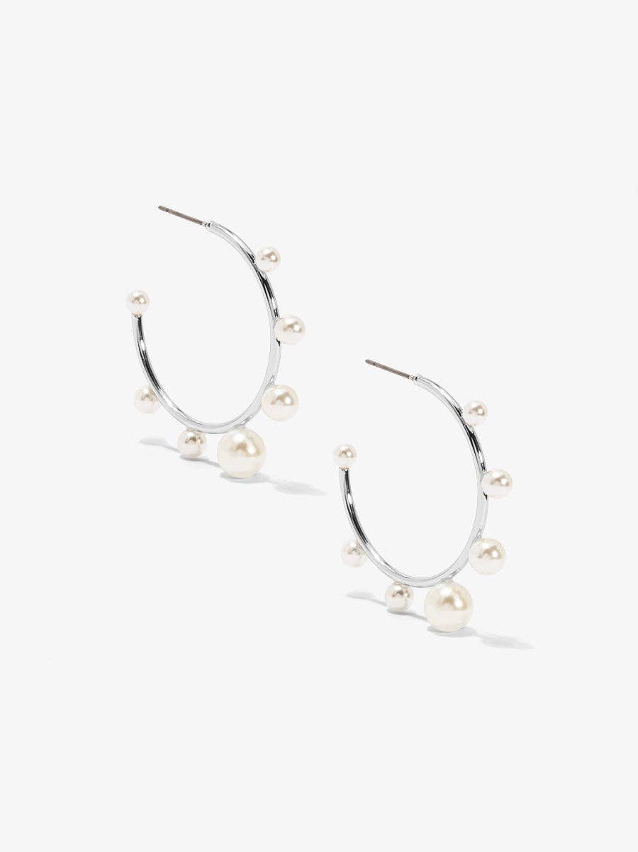 Small, gold-tone hoop earring embellished with spaced