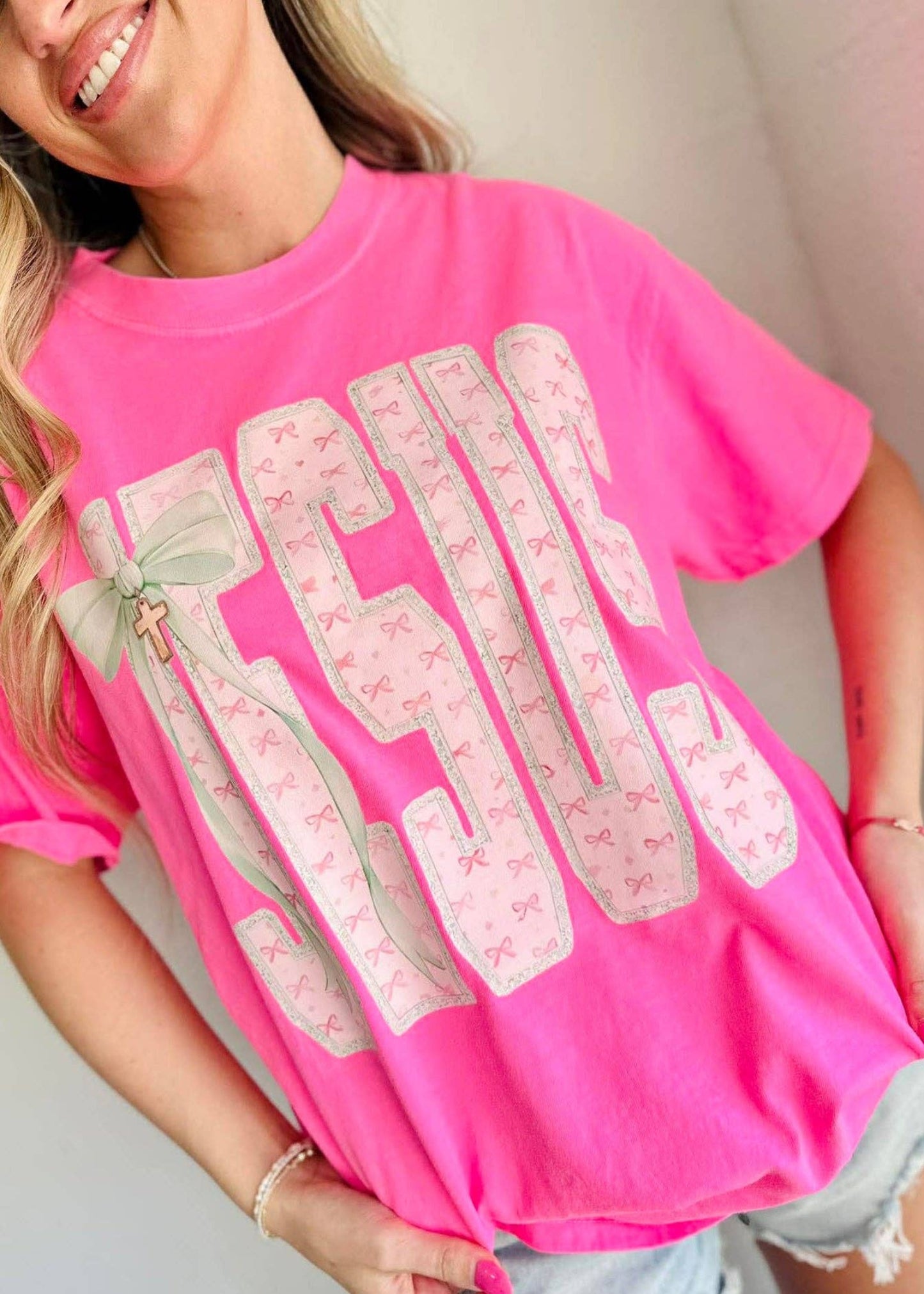 JESUS NAME BOW CROSS CHARM SHIRT - NEON PINK