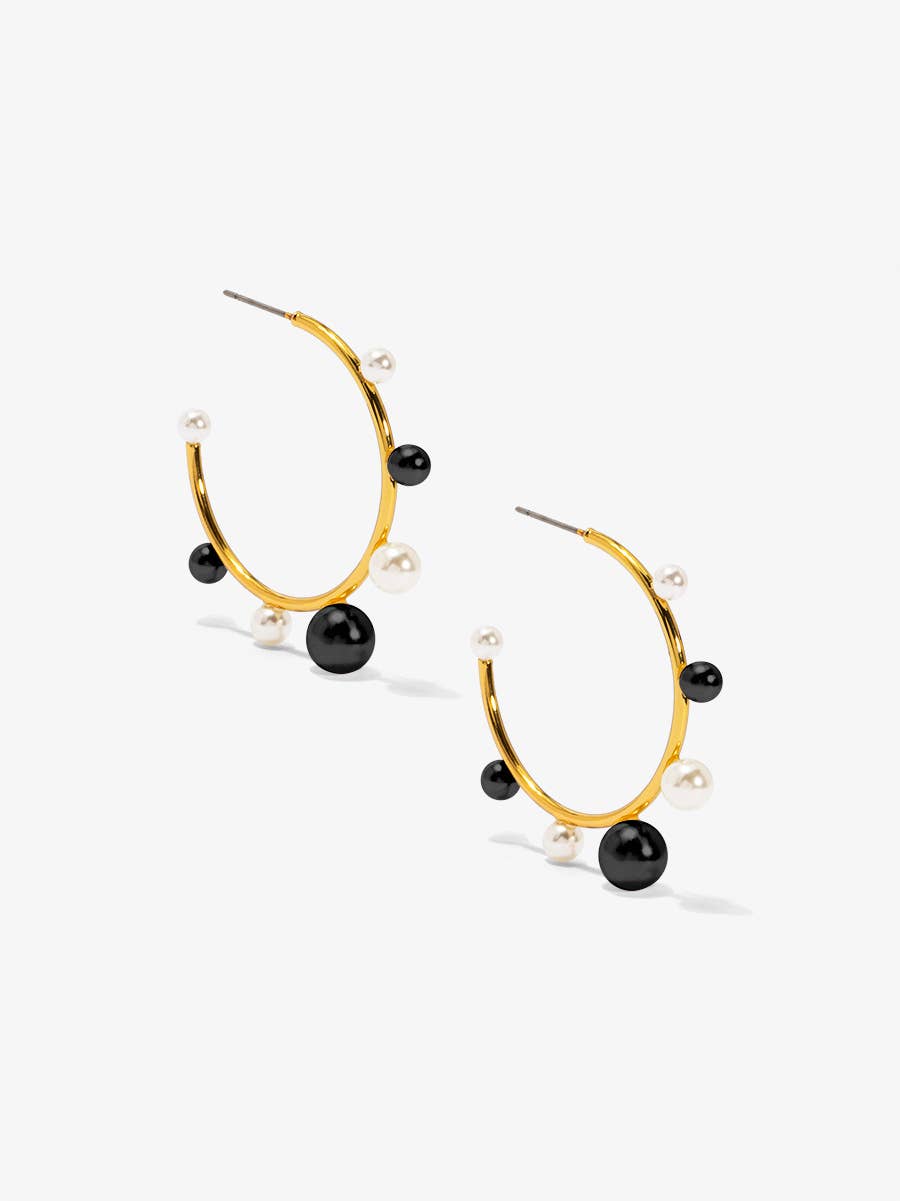 Small, gold-tone hoop earring embellished with spaced