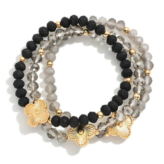 Set Of Three Beaded Stretch Bracelets Featuring Metal Tones, Faceted Beads, & Clover