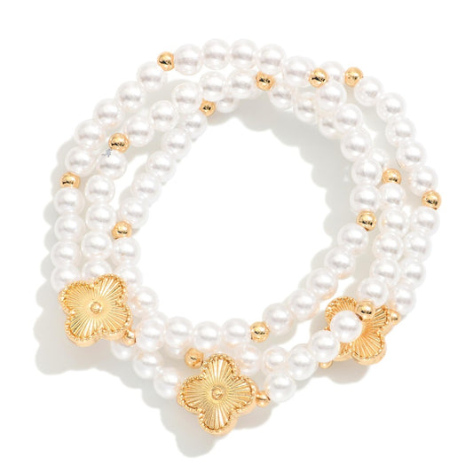 Set Of Three Beaded Stretch Bracelets Featuring Metal Tones, Faceted Beads, & Clover