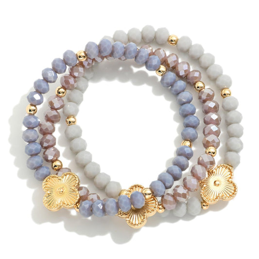 Set Of Three Beaded Stretch Bracelets Featuring Metal Tones, Faceted Beads, & Clover