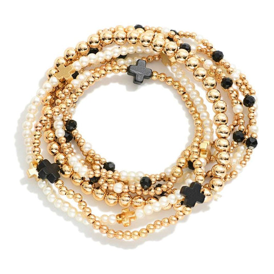 SET OF SEVEN GOLD TONE BEADED BRACELETS