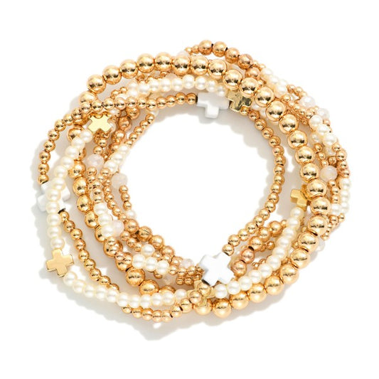 SET OF SEVEN GOLD TONE BEADED BRACELETS - WHITE AND GOLD