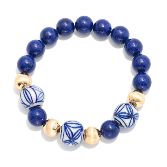GOLD AND BLUE BRACELET WITH CHINOISERIE BEADS