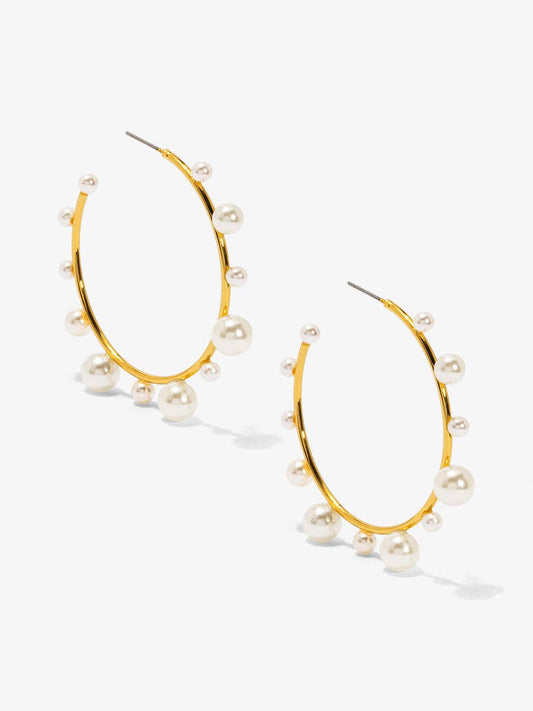 Shiny, gold-tone hoop earring